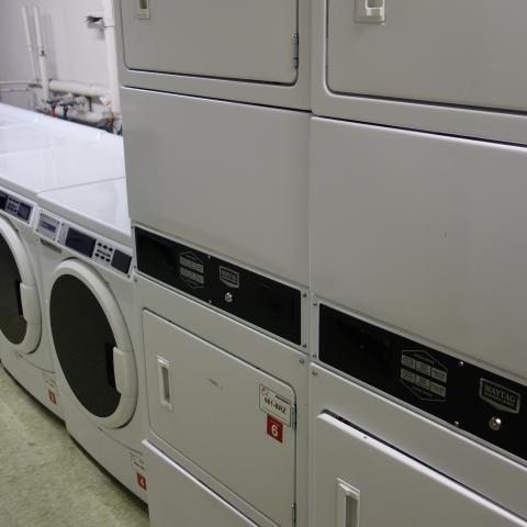 Kusch House Basement Laundry Room with washers and stacked dryers