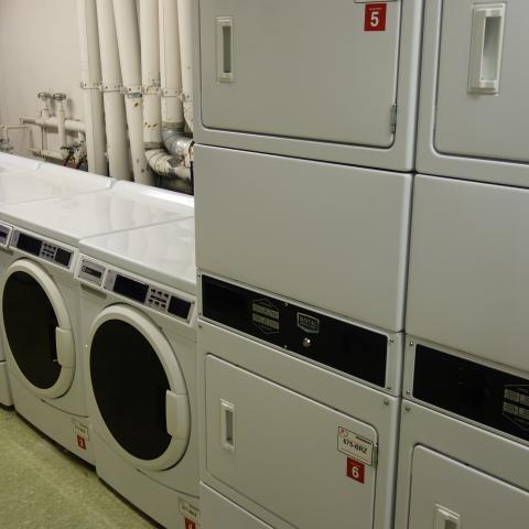 Glaser House Basement Laundry Room with washers and stacked dryers