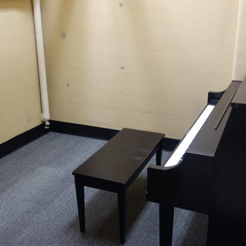 Glaser House Basement Practice Room with common piano and stool