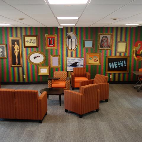 Michelson House 1st Floor Lounge showing chairs, tables, and mural