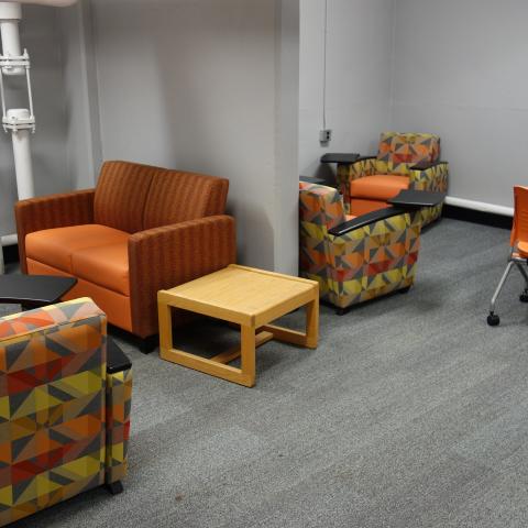 Michelson House Basement Group Study Lounge showing tables and chairs