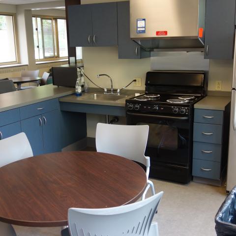 Tippit House Common Kitchen showing table, chairs, and appliances