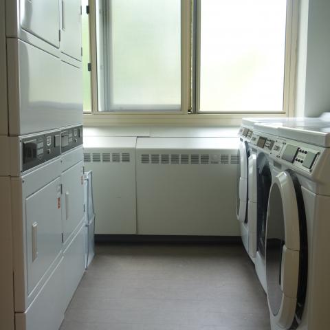 Tippit House Laundry Room showing washers and stacked dryers