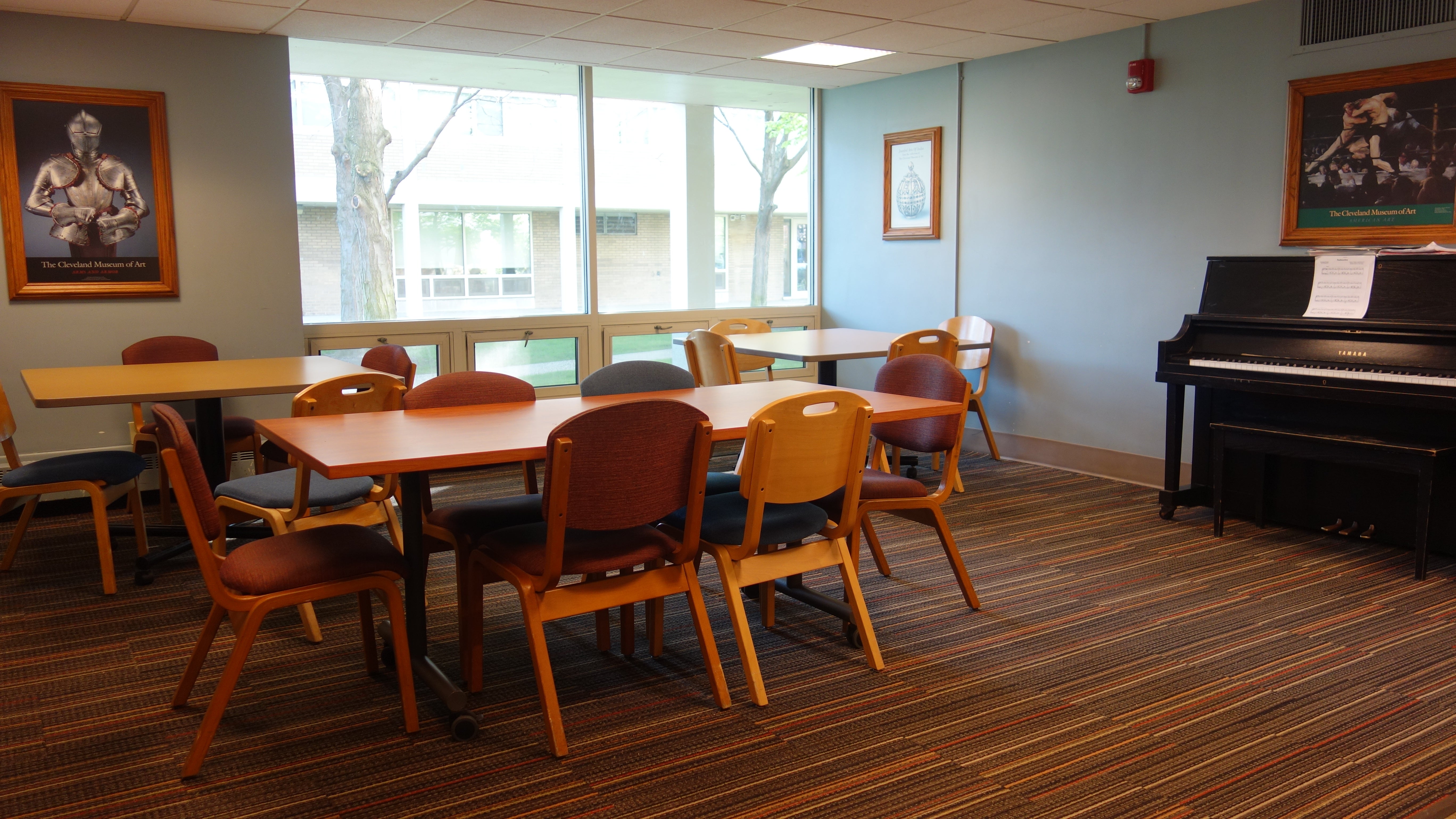 Smith House kitchen lounge showing tables, chairs, and common piano