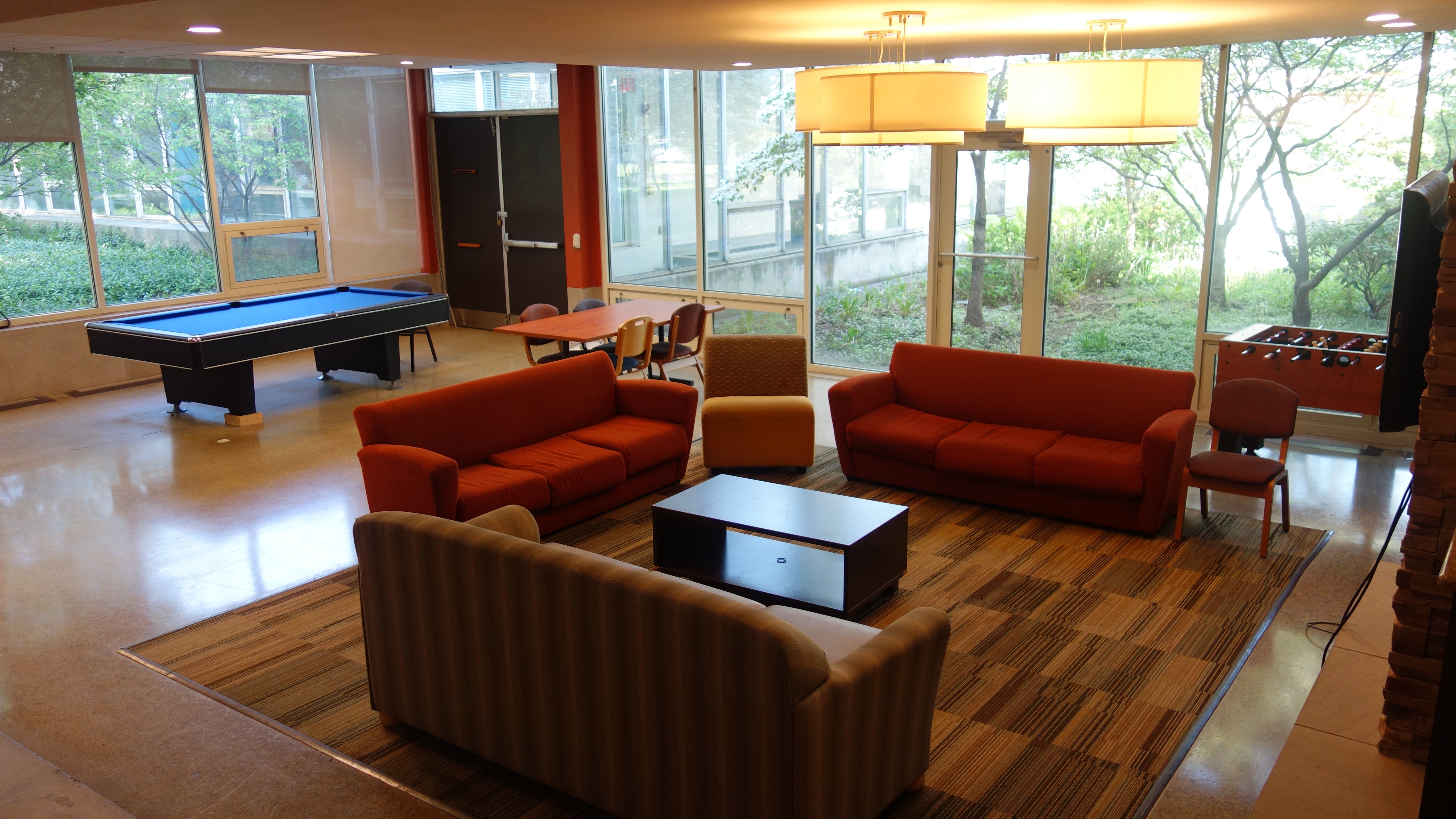 Taft House Common Room with furniture, television, and game tables