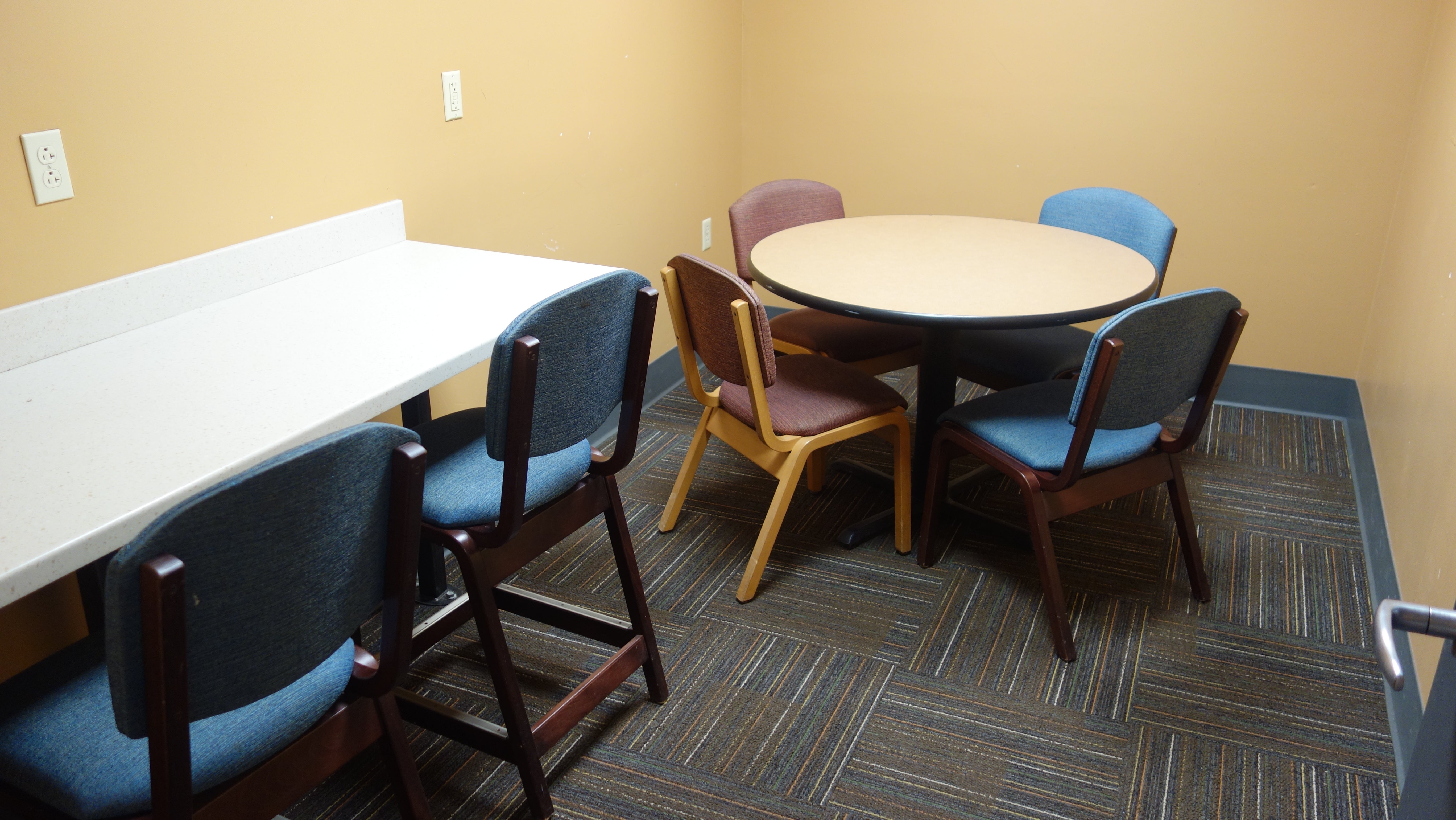 Taplin House Study Room with table, chairs, and bar stools