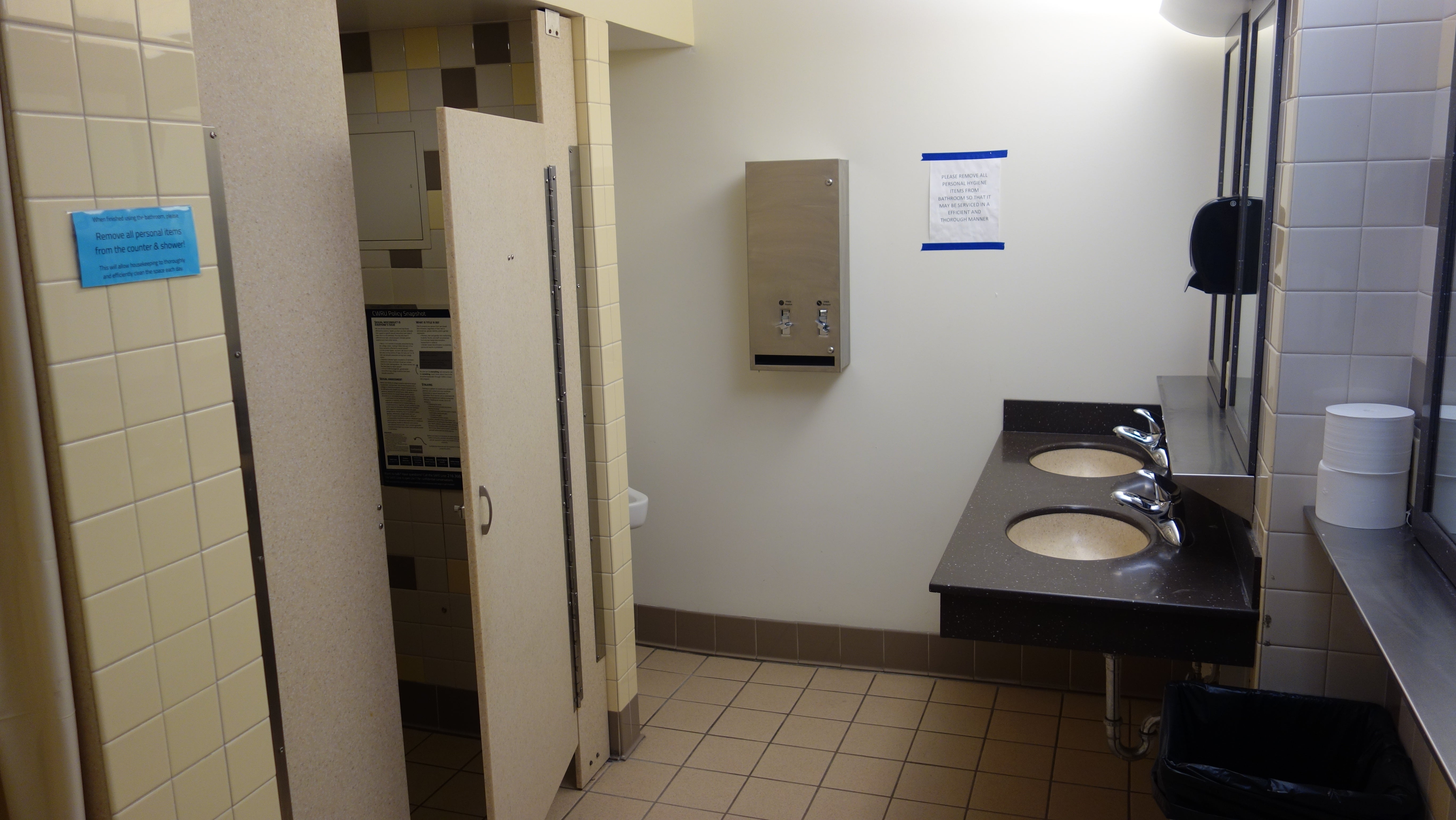 Cutler House Bathroom with urinal, shower stall, and sinks