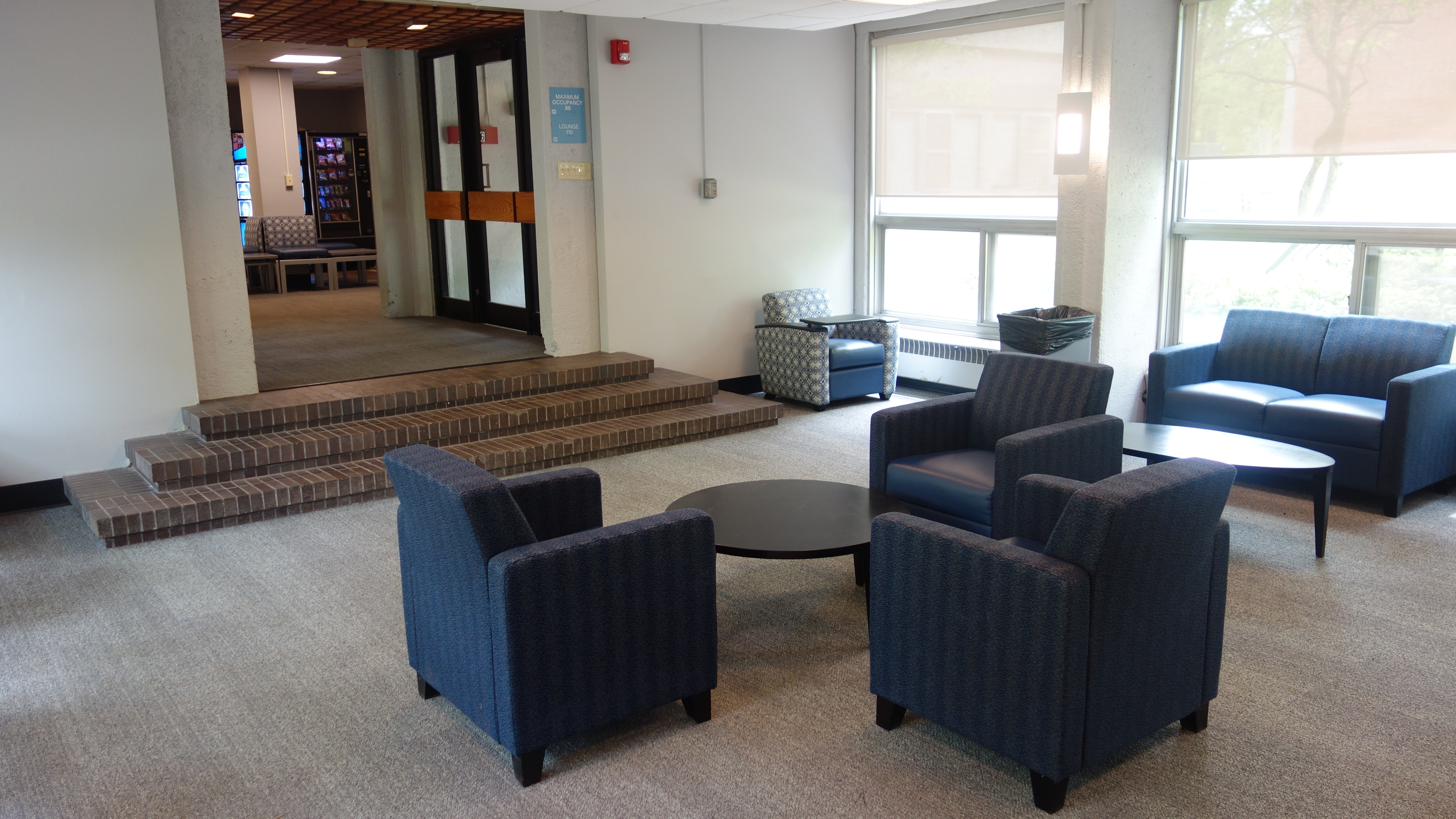 Kusch House 1st Floor Lounge showing furniture, tables and main hallway