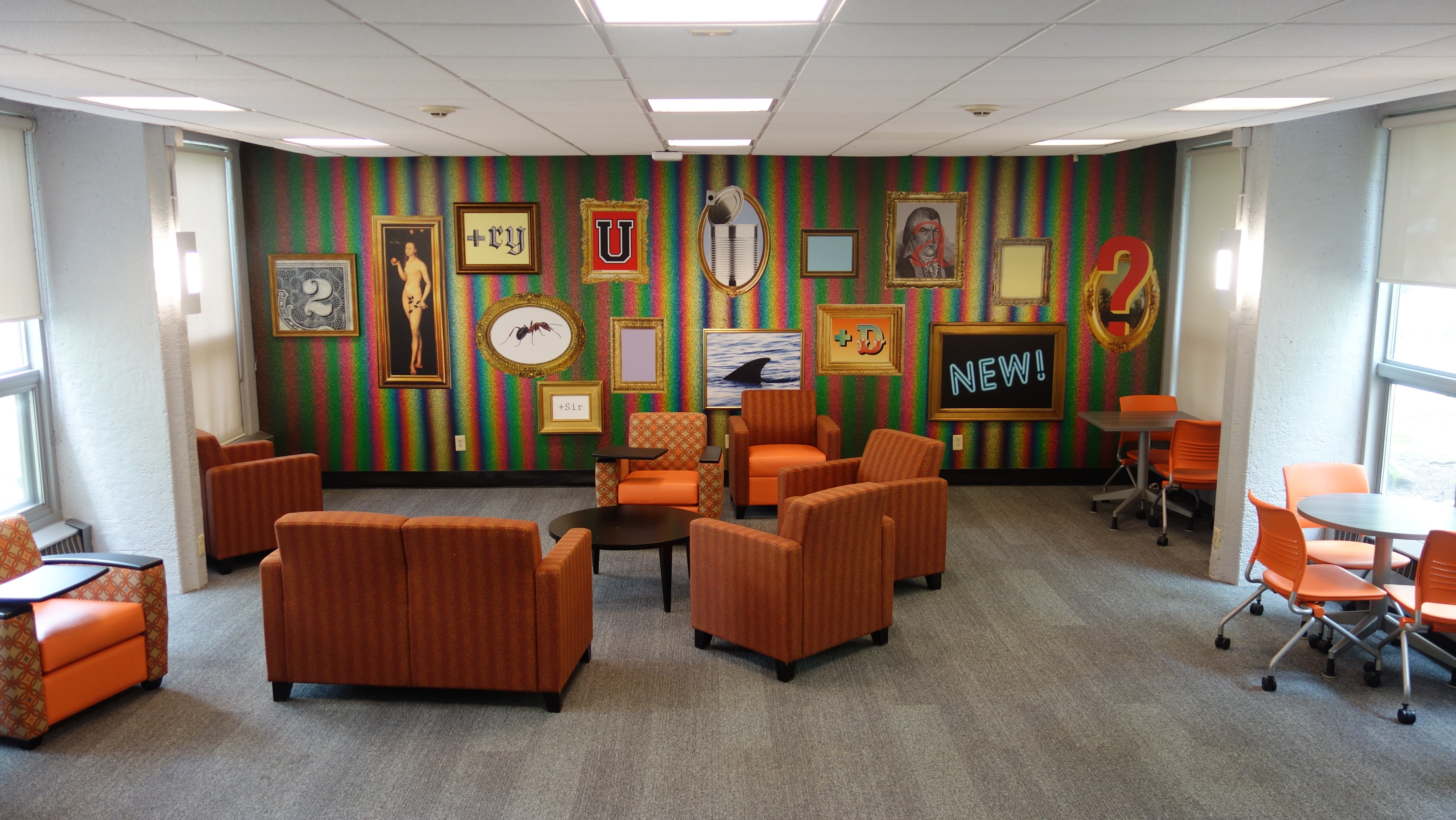 Michelson House 1st Floor Lounge showing chairs, tables, and mural