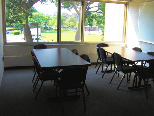Storrs House Upper Floors Lounge with two tables and chairs
