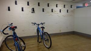Smith House indoor bike storage room with wall-mounted bike hooks