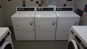 Tyler House Laundry Room with washing and drying machines