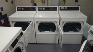 Sherman House Laundry Room with washing and drying machines