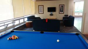 Sherman House Common Room with pool table, furniture, coffee tables, and television