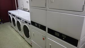 Kusch House Basement Laundry Room with washers and stacked dryers