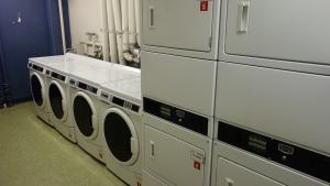 Glaser House Basement Laundry Room with washers and stacked dryers