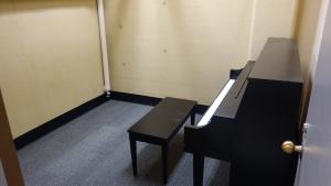 Glaser House Basement Practice Room with common piano and stool
