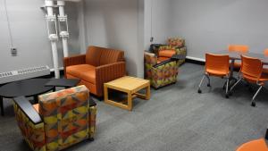 Michelson House Basement Group Study Lounge showing tables and chairs