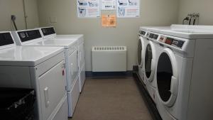Howe House 1st Floor Laundry Room with washing and drying machines