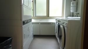 Tippit House Laundry Room showing washers and stacked dryers