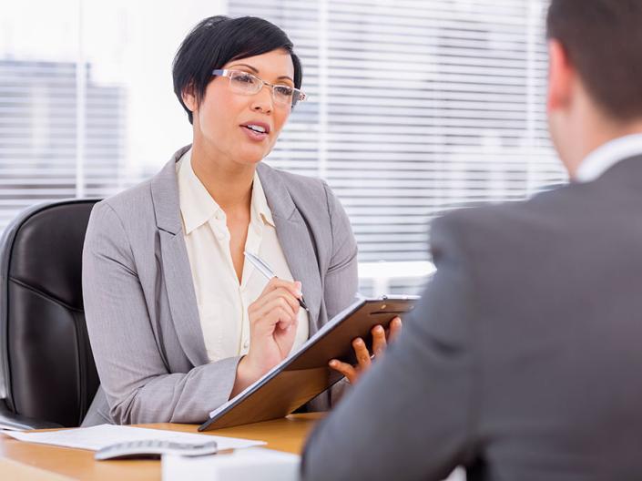 Man talking to employees.