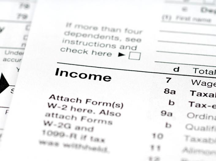 A tax form - focused on the income section where you need to attach your W2