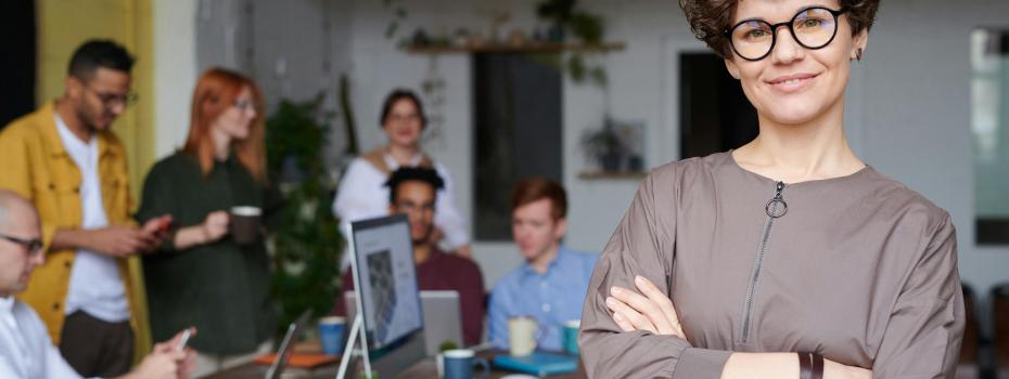 Employee with team members working at table