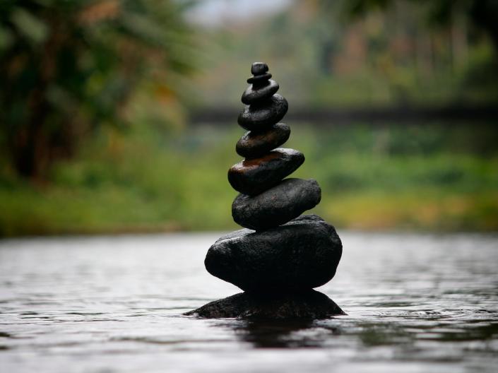 Zen rocks stacked vertically.