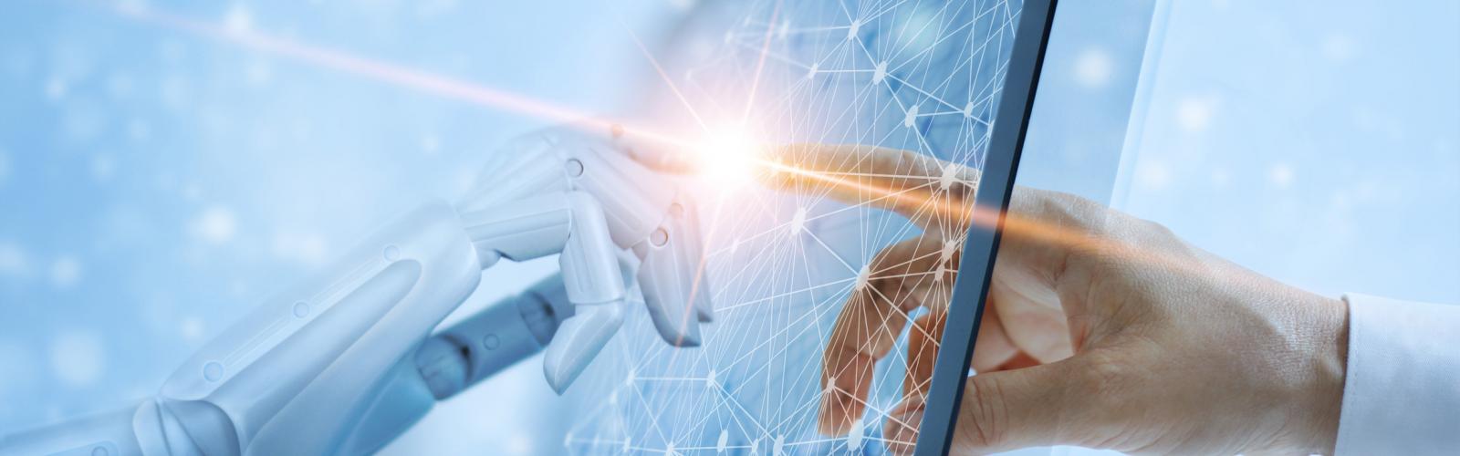 A human hand and robot hand touch fingers 