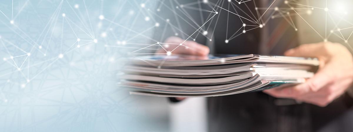 Image of a man holding publications
