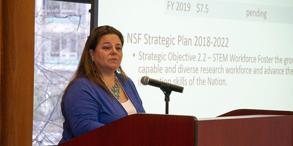 Woman speaker at Annual Plenary 2018 with a slide that states "NSF Strategic Plan 2018-2022"