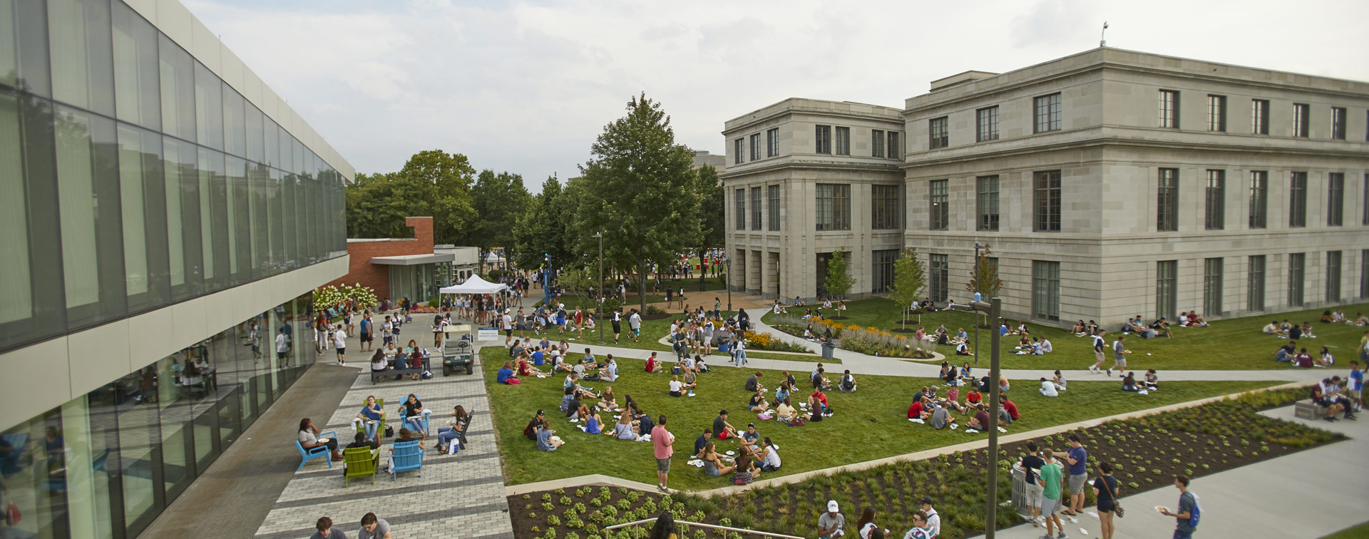 Photo of taken from above of student gathered together on the lawn between Tinkham Veale University Center and Kelvin Smith Library