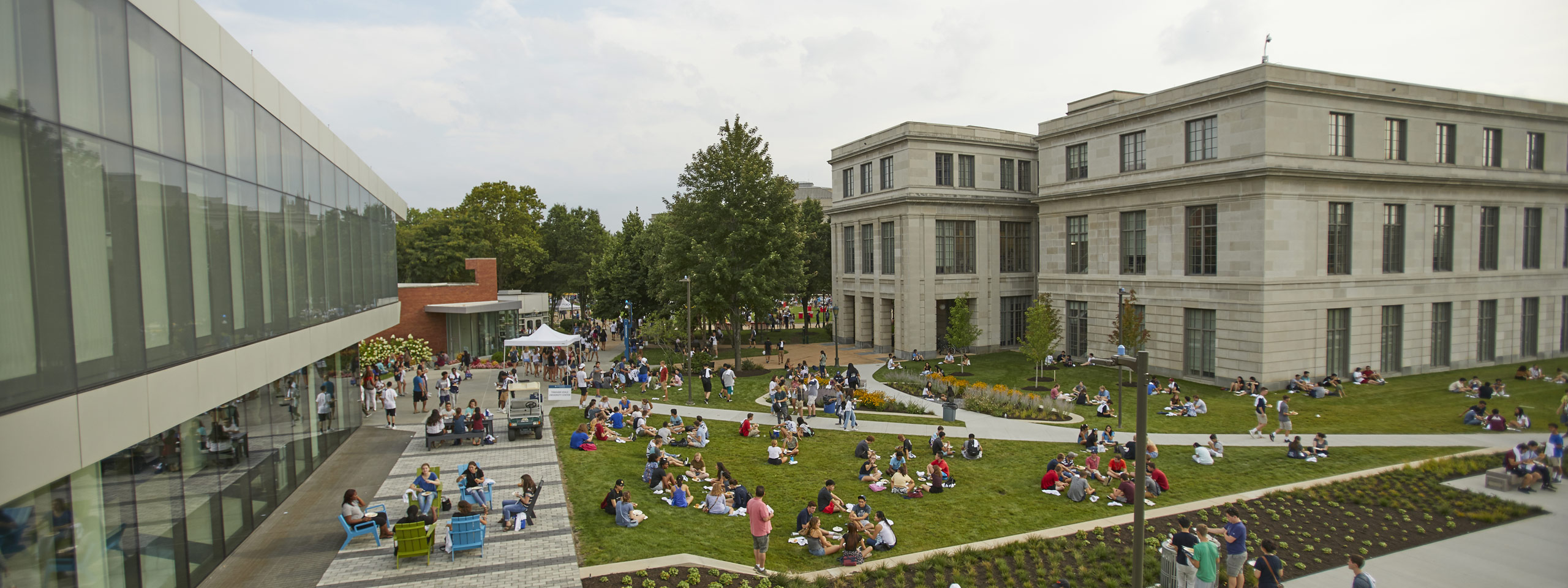Photo of taken from above of student gathered together on the lawn between Tinkham Veale University Center and Kelvin Smith Library