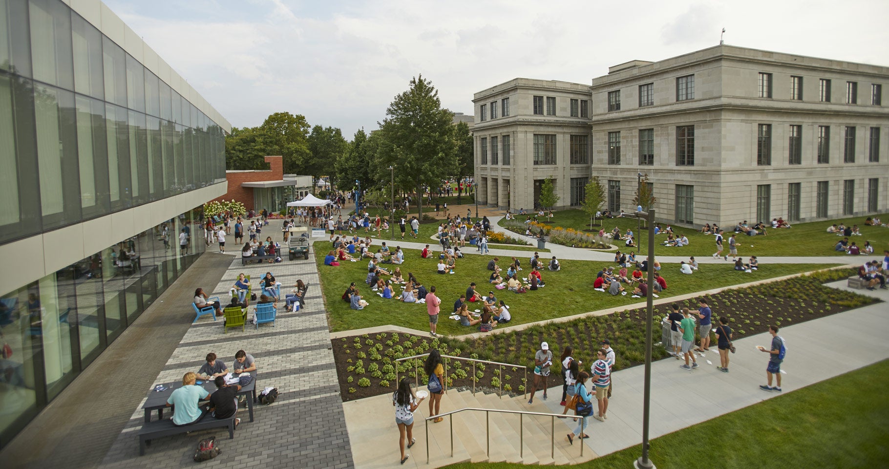 Photo of taken from above of student gathered together on the lawn between Tinkham Veale University Center and Kelvin Smith Library