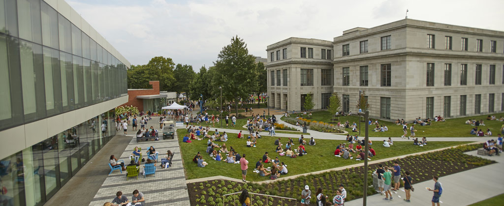 Photo of taken from above of student gathered together on the lawn between Tinkham Veale University Center and Kelvin Smith Library