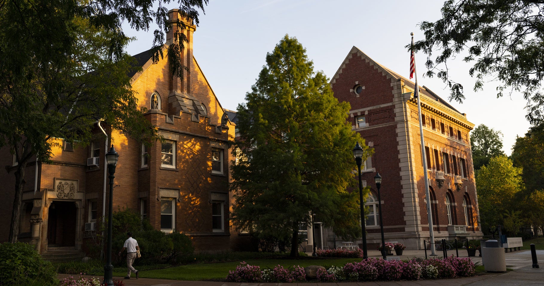 Photo of the sun setting and shining on the Thwing Center on the CWRU campus