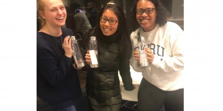 After a fun night of bonding and ethical competition, GELS members Halle, Lucille, and Koko pose with water bottle prizes after winning Ethics Bowl Night. 