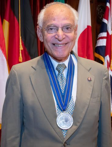 Dr. Farouk El-Baz with medal