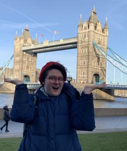 Talia Eshenbaugh poses in front of the Tower Bridge in London, England