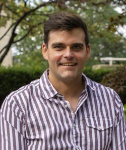 A headshot of Kevin Sullivan outside on the Case Quad
