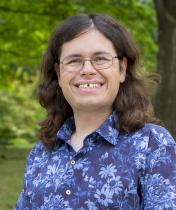 A headshot of Alec Jokubaitis outside on the Case Quad