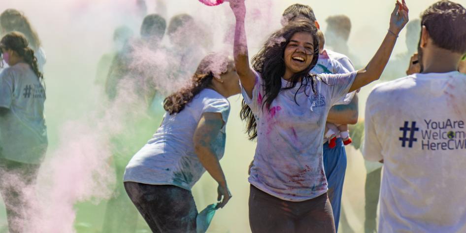 Students throwing color during Holi 2019