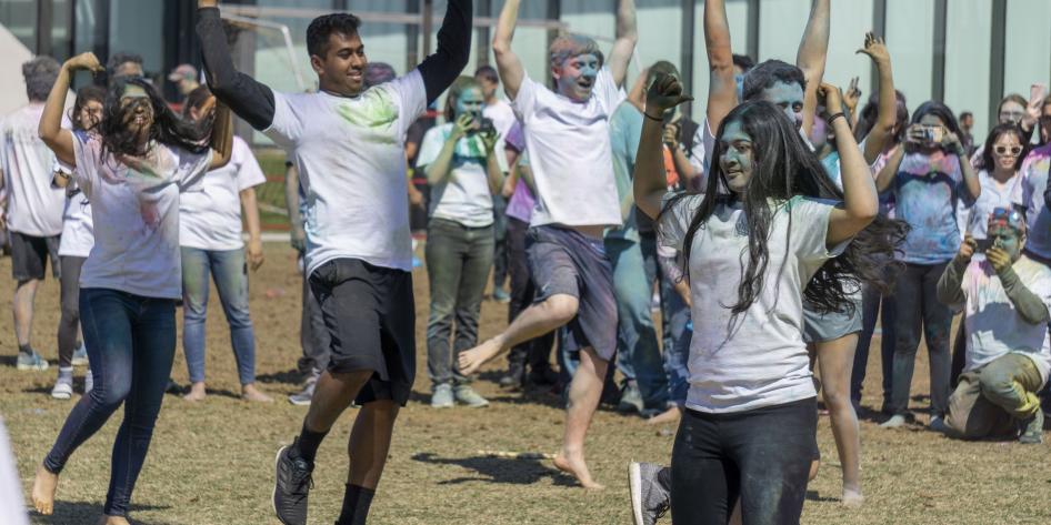 Students dance during the 2019 Holi festival