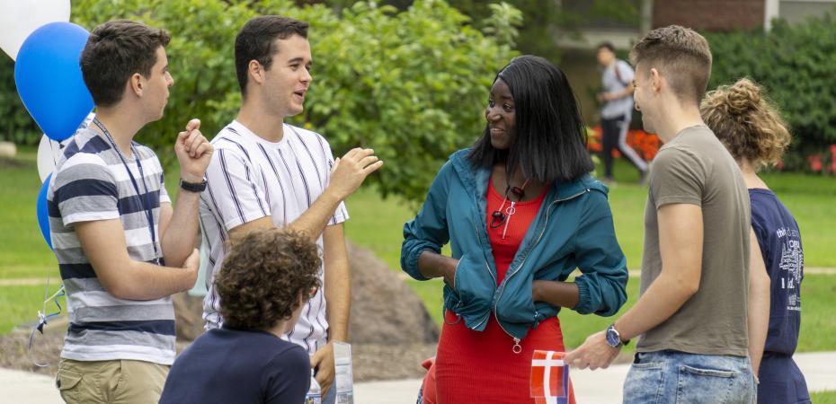 A picture of CWRU students talking to each other outside at the Study Abroad Fair