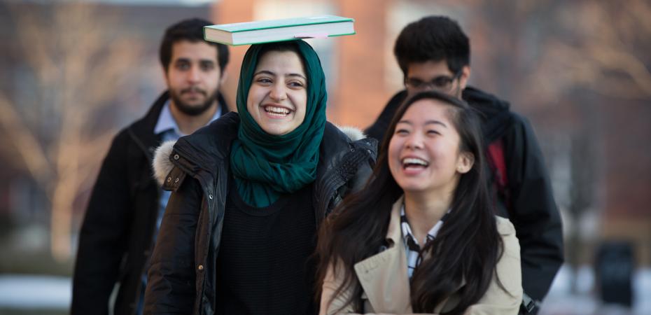 Four CWRU students walk together outside