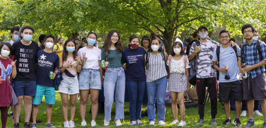 A group of international students standing together at the Fall 2021 Welcome [Back] Party 