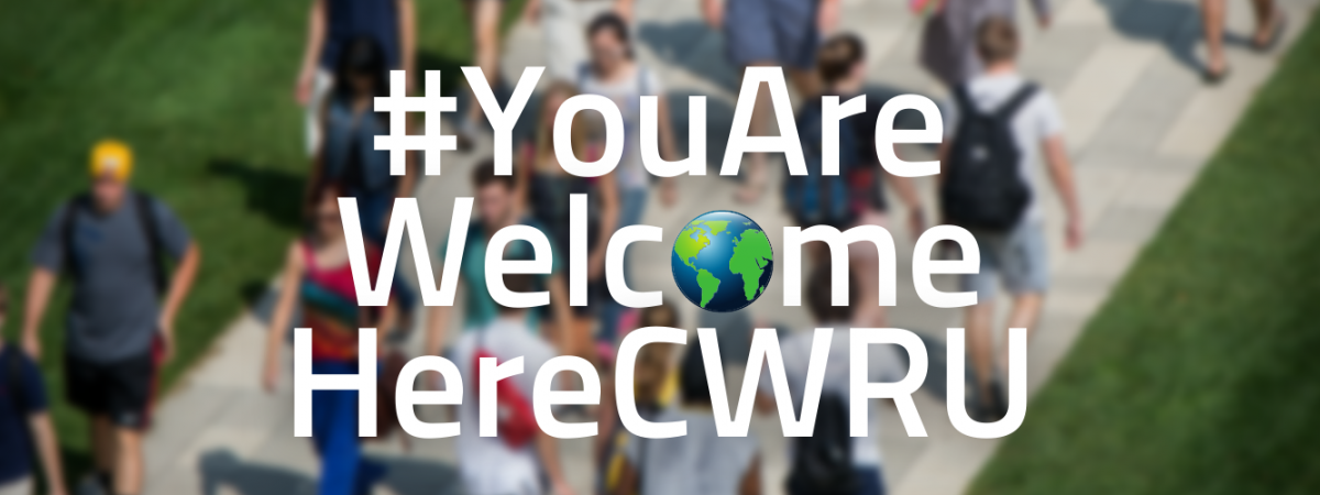 #YouAreWelcomeHereCWRU | students walking outside on the CWRU binary walkway