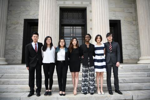 The officers of International Club stand outside on the steps of the Cleveland Art Museum