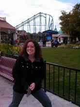 A picture of Autumn Beechler Stebing at Cedar Point standing outside in front of a roller coaster