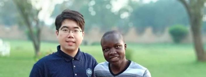 Bill Ding with a student from Makerere University in Uganda